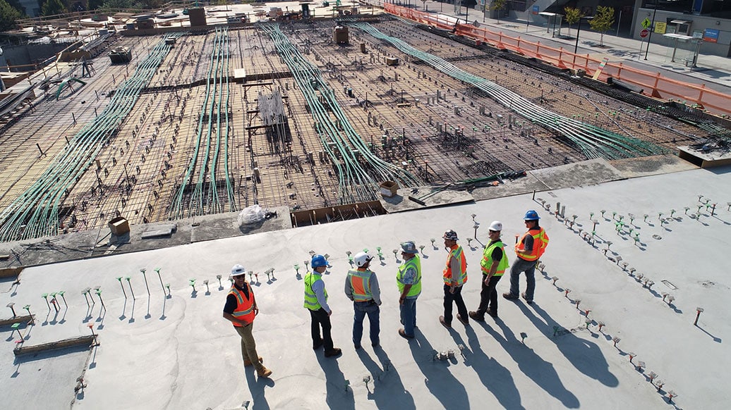 group of site surveyors overlooking electric grid