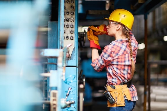 experienced contractor performing maintenance on a machine