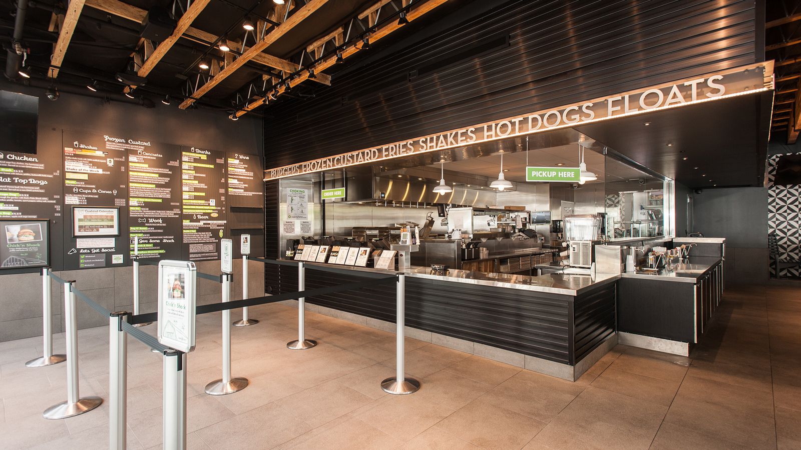 Shake Shack interior store featuring menu and grill in the background