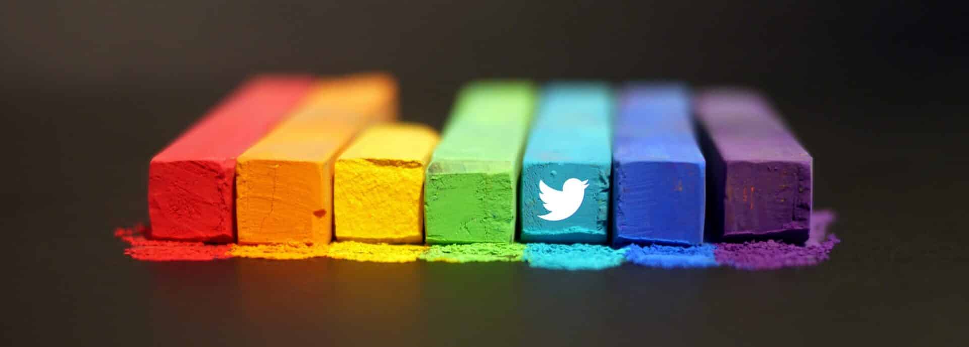 rectangular chalk prisms arranged in a rainbow color scheme with twitter's bird logo on one of them