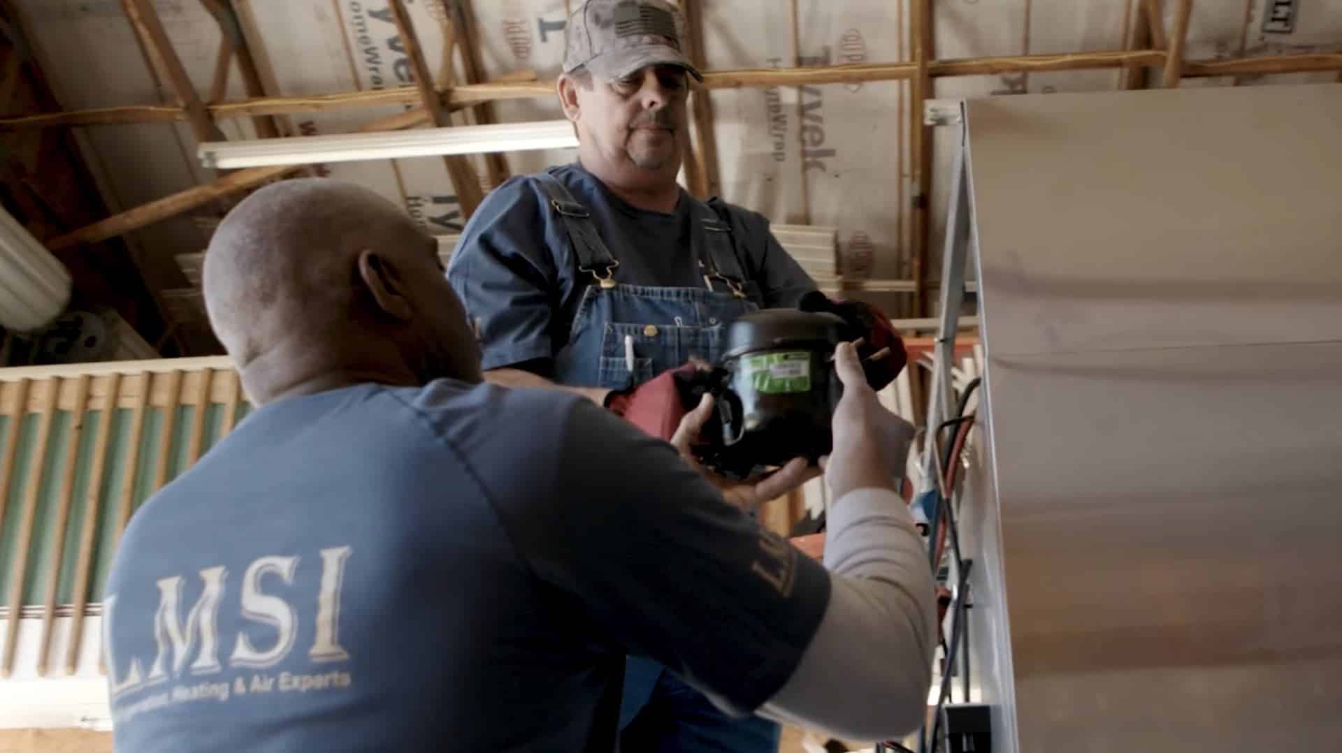 two lampien technicians constructing a residential interior installation