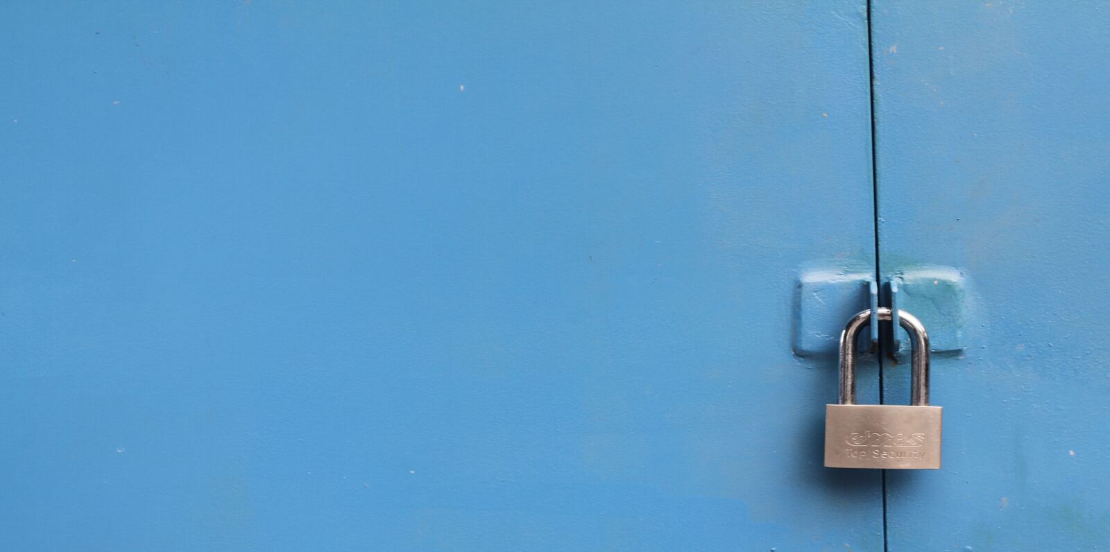 lock hanging from a secured door