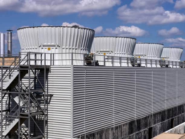 industrial cooling towers on top of a building
